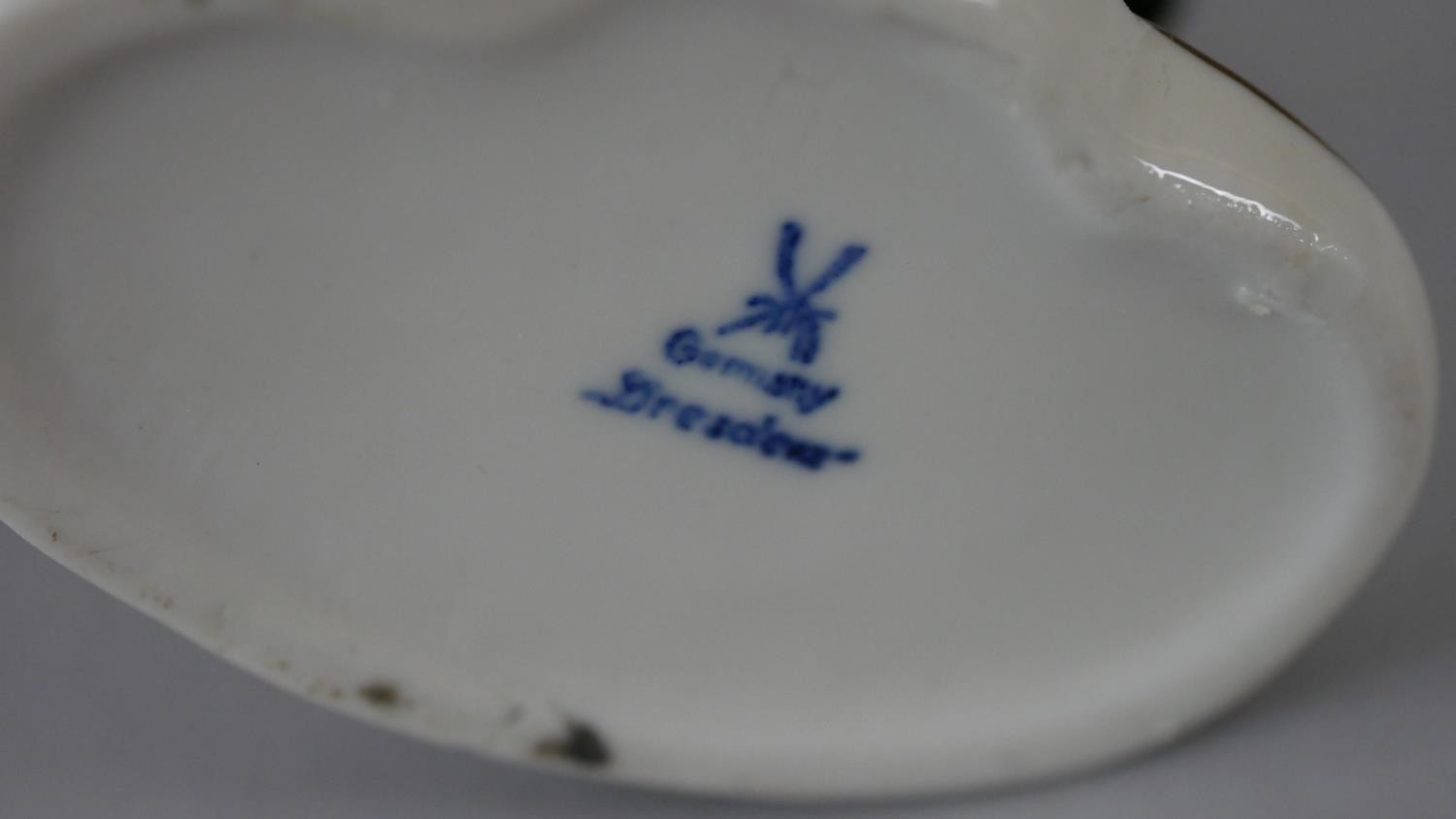 A pair of black and white Staffordshire pottery spaniels along with a hand painted Dresden porcelain - Image 6 of 7