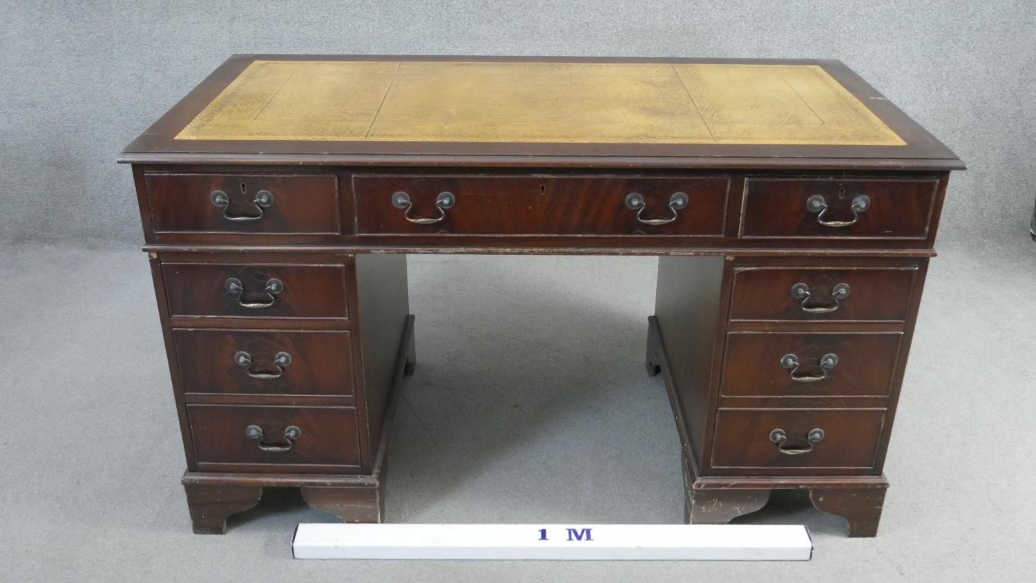 A Georgian style mahogany pedestal desk with inset tooled leather top on bracket feet. H.75 W.136 - Image 6 of 6