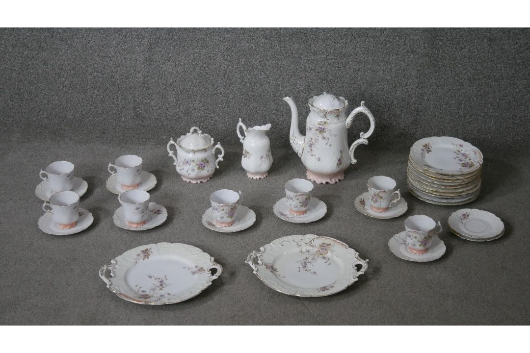 A Victorian hand painted fine china ten person part coffee set. Decorated with violets and gilded - Image 1 of 14