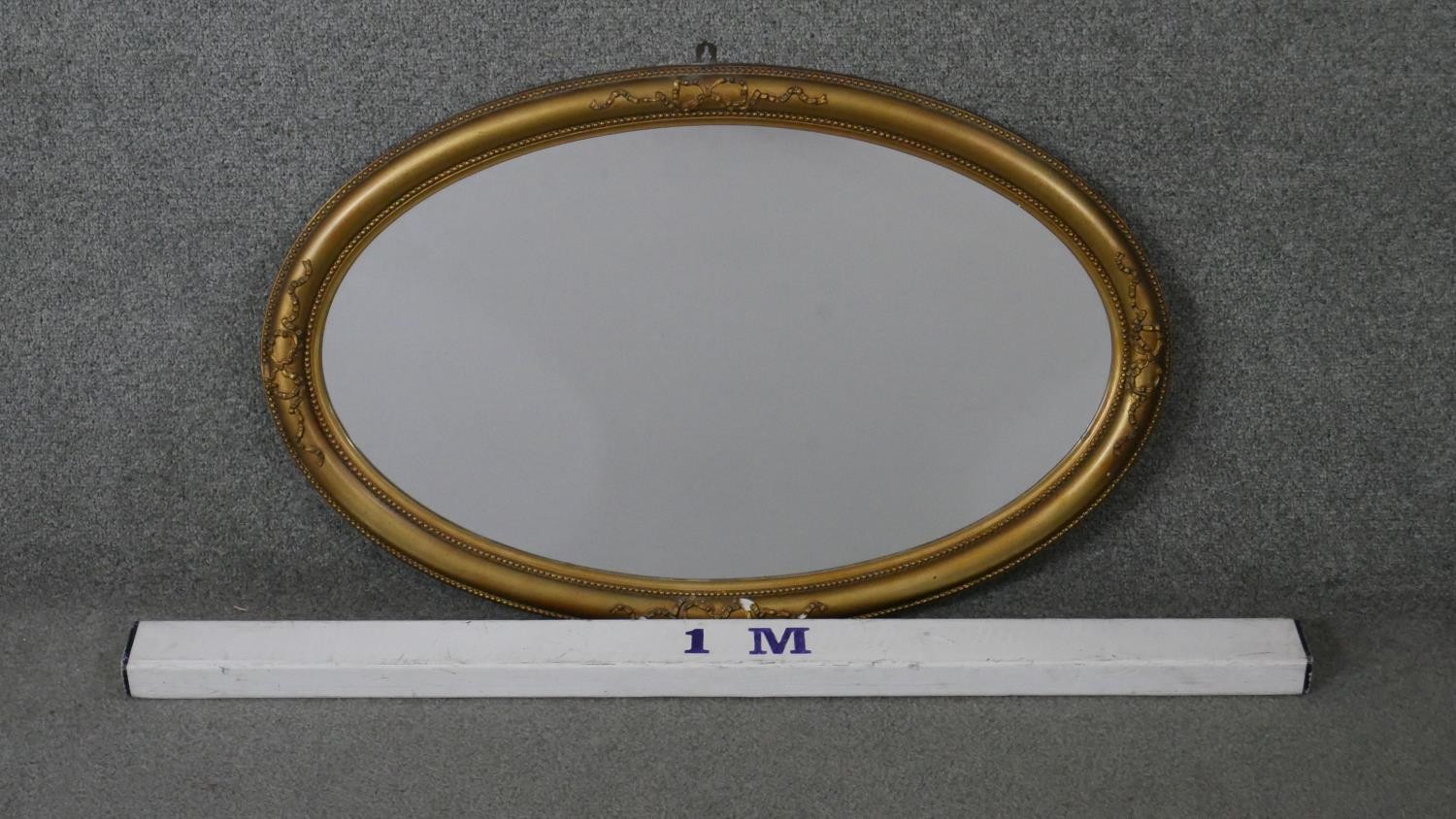 A C.1900 oval wall mirror in gilt ribbon and beaded gesso frame. H.50 W.78cm - Image 2 of 5