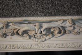 A dressing mirror in painted Rococo style frame. H.60 W.127 cm.
