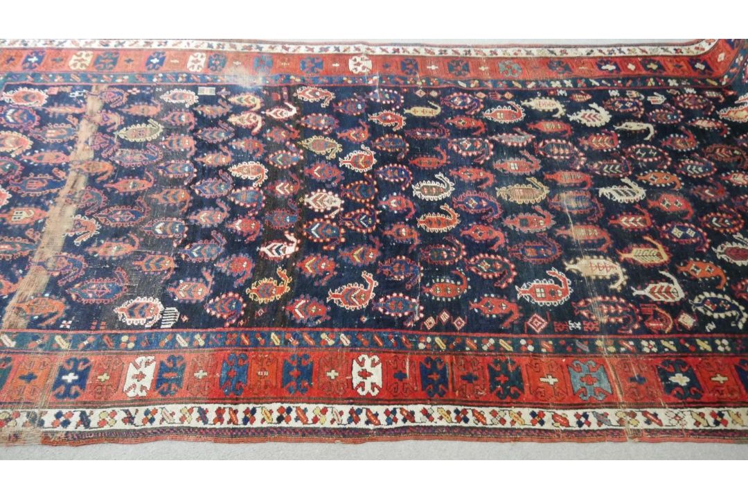 A large Kurdish runner with repeating motifs across the midnight ground within stylised multiple - Image 4 of 5