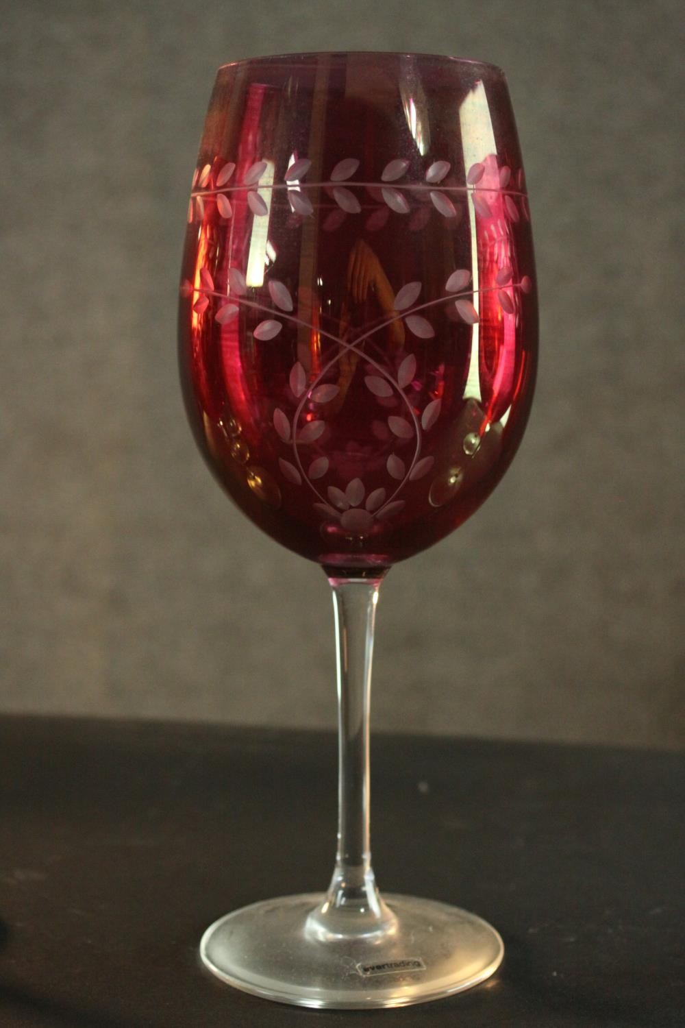 Six large hand etched Cranberry glass wine glasses, with a stylised foliate design. H.24 Dia.8cm. - Image 3 of 5
