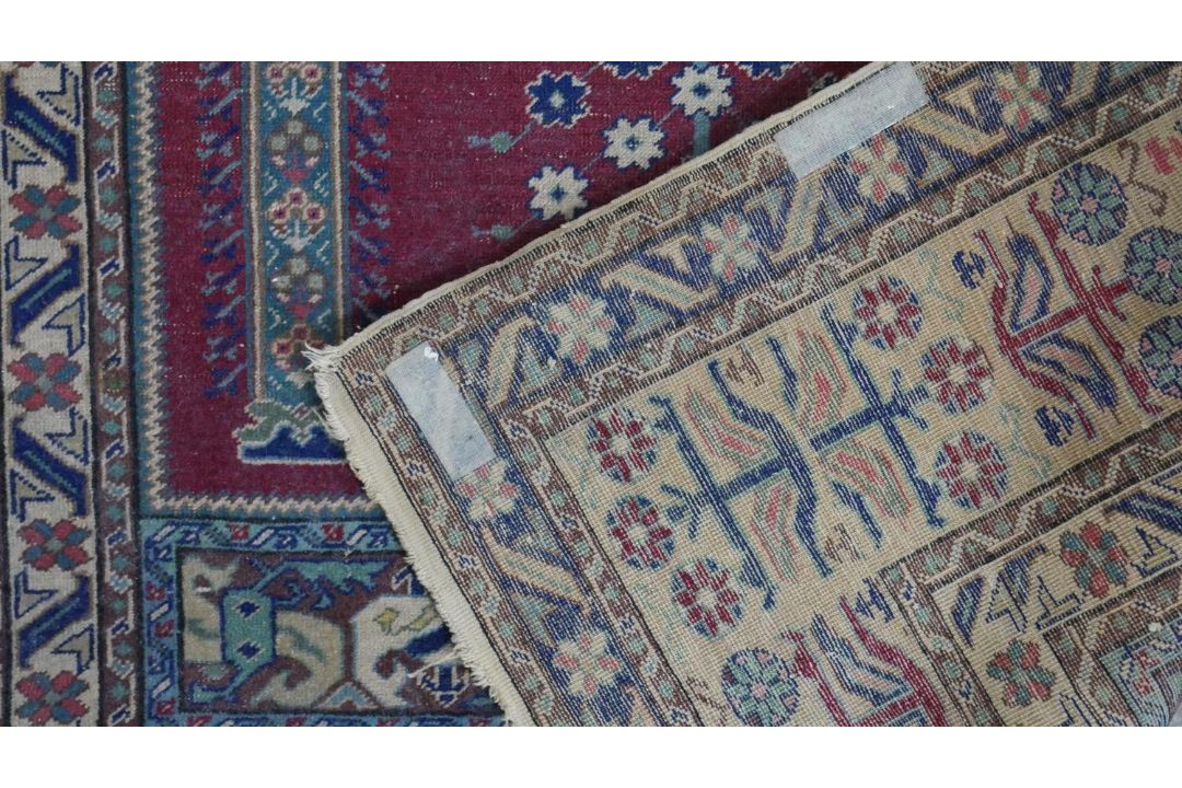 A Turkish Kayseri prayer mat with burgundy ground and floral multiple borders. L.170 W.115cm - Image 7 of 7