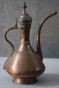 An 18th century copper samovar. The samovar has a snake form handle and is impressed '1798', with