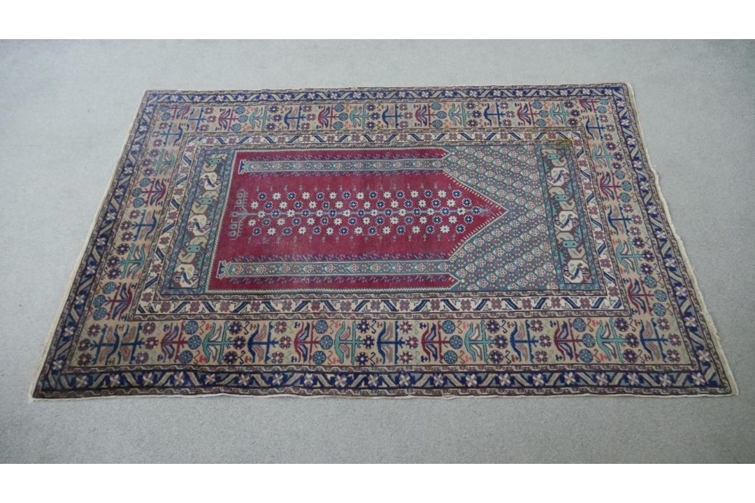 A Turkish Kayseri prayer mat with burgundy ground and floral multiple borders. L.170 W.115cm - Image 1 of 7