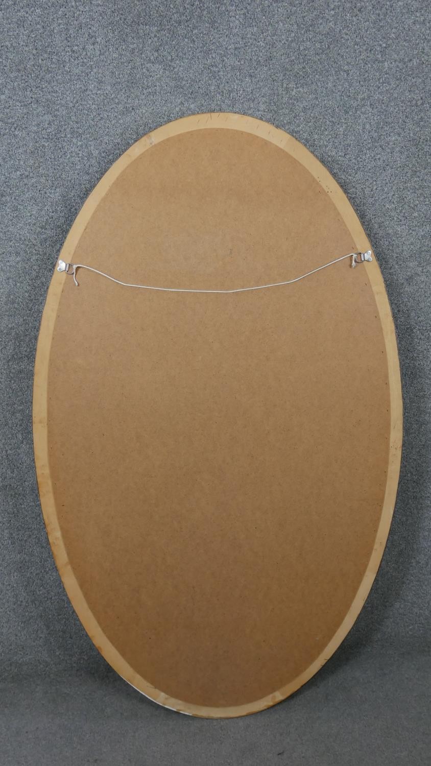 A large 20th century gilt framed wall mirror with beaded detailing. H.126 W.75cm - Image 4 of 4