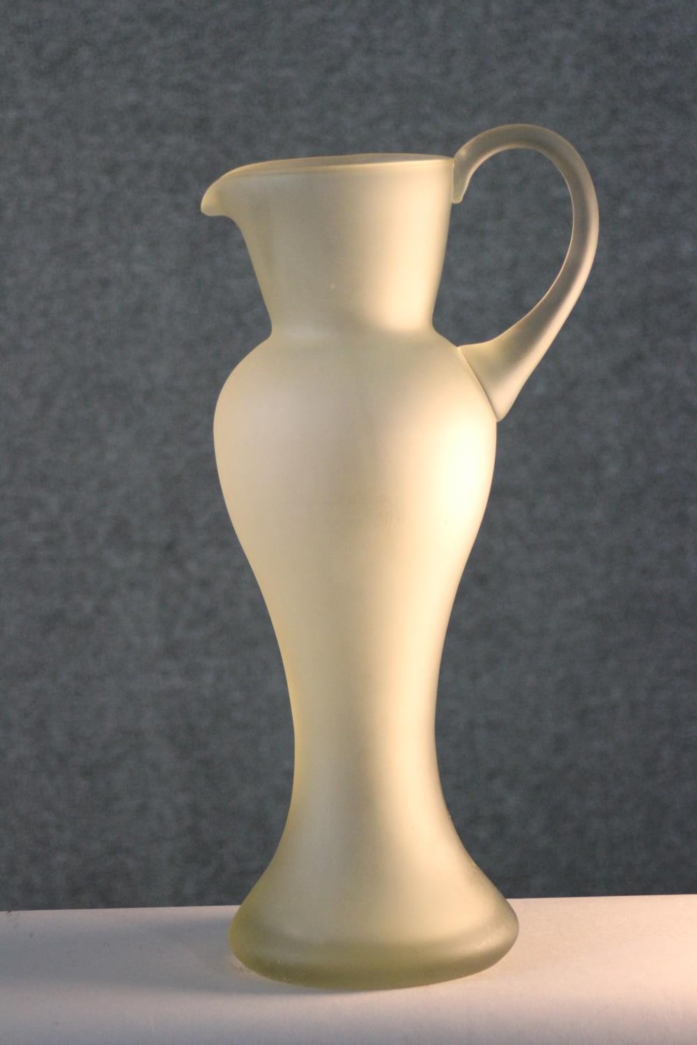 A vintage hand blown frosted clear art glass jug of elongated form. H.39 W.18 D.14cm. - Image 2 of 6