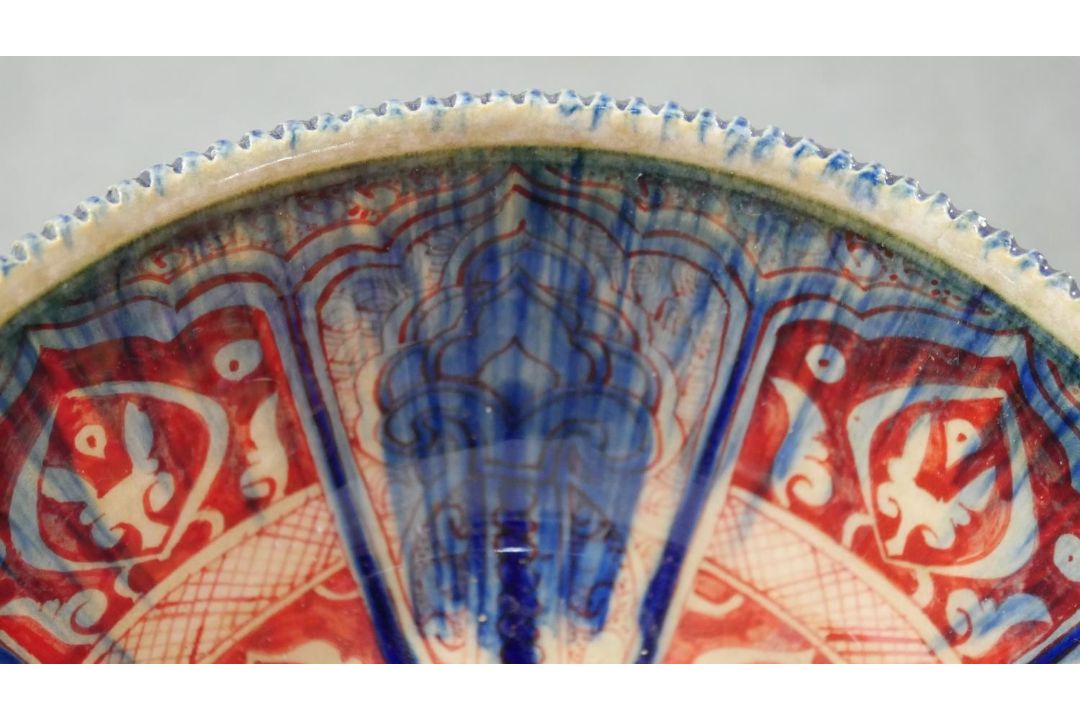 A Persian glazed ceramic bowl, the interior decorated with floral motifs, marked and dated to - Image 3 of 7