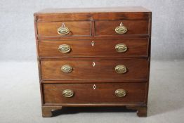 A Georgian mahogany chest of two short above three long drawers on bracket feet. H.87 W.87 D.45 cm.