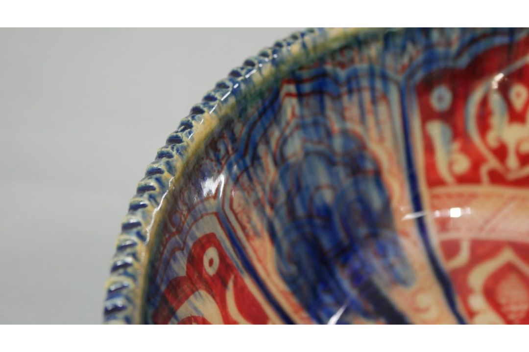 A Persian glazed ceramic bowl, the interior decorated with floral motifs, marked and dated to - Image 6 of 7