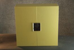 A pair of Louis Roederer champagne glasses in a presentation case. (One glass is missing from the