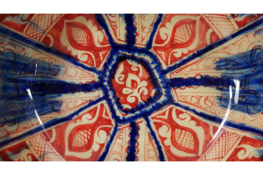 A Persian glazed ceramic bowl, the interior decorated with floral motifs, marked and dated to - Image 2 of 7