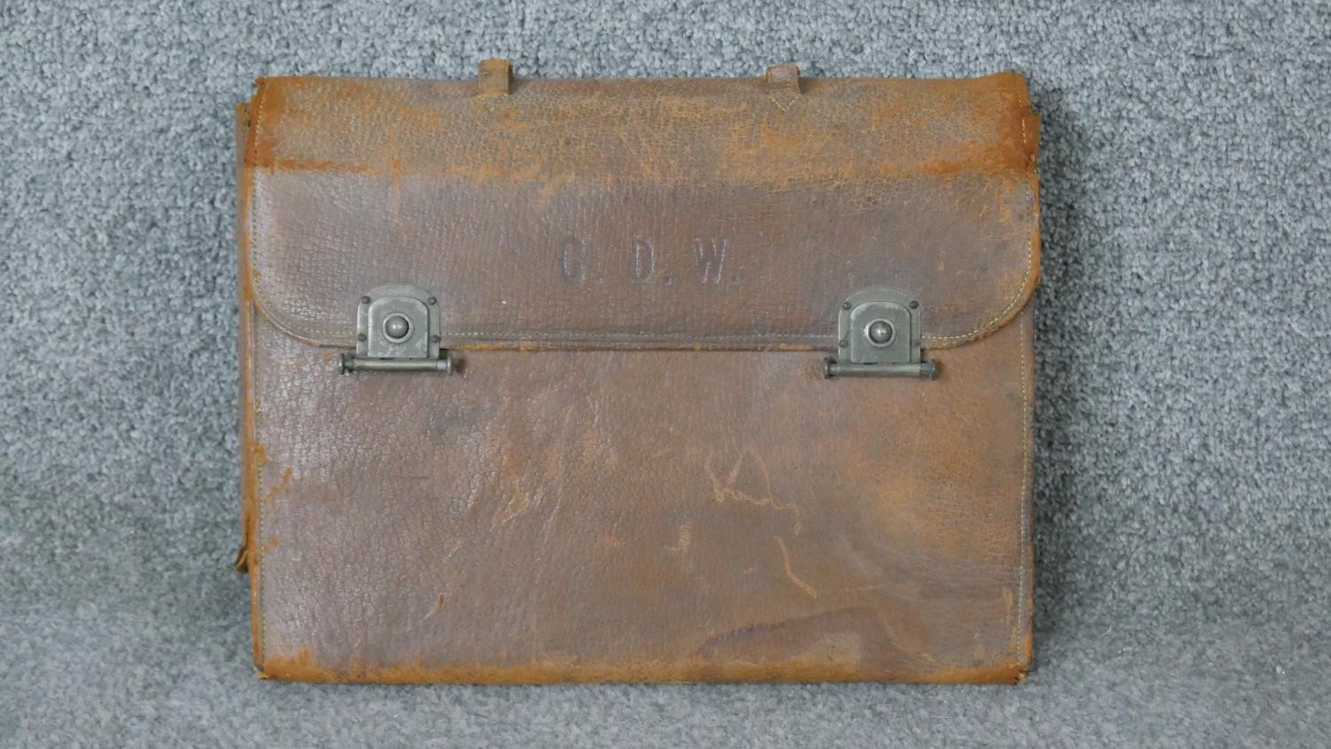 A leather cased travelling vintage men's grooming kit. Some pieces with ebony handles, includes,