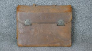 A leather cased travelling vintage men's grooming kit. Some pieces with ebony handles, includes,