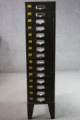 A vintage metal stationery cabinet. H.120 W.28 D.40cm.
