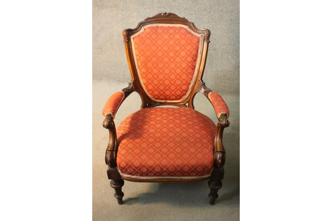A late 19th century carved mahogany armchair in geometric floral upholstery on fluted tapering - Image 1 of 4