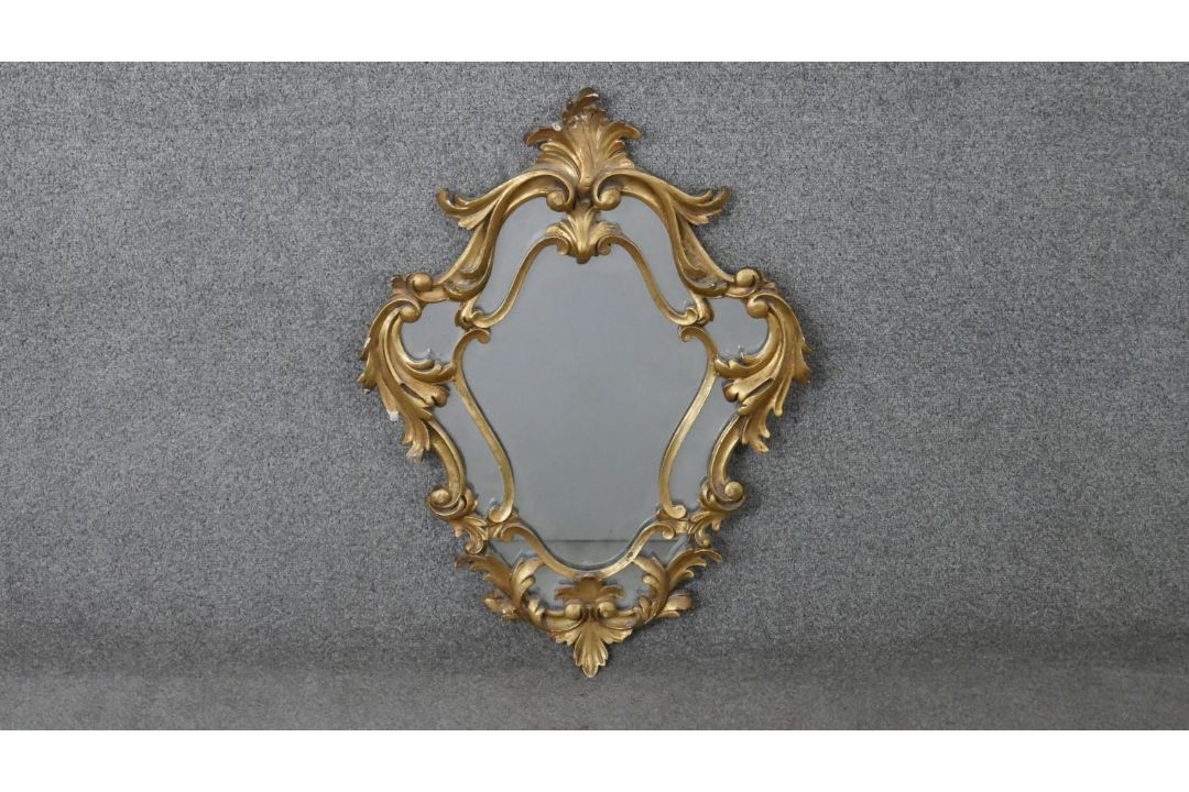 A carved giltwood Florentine style wall mirror. H.73 W.52cm - Image 1 of 5