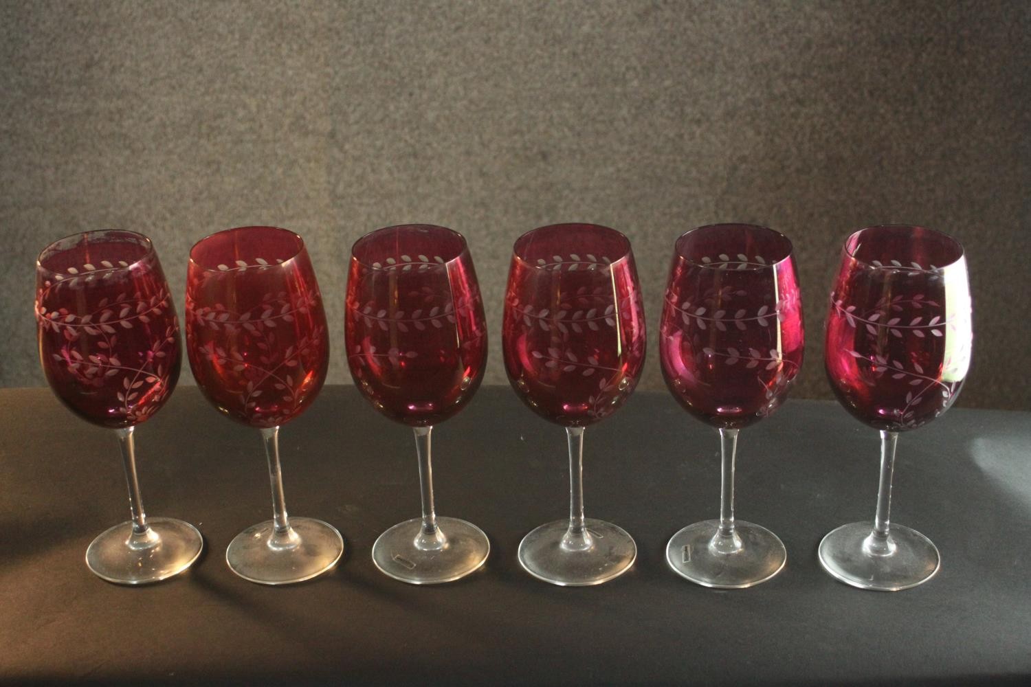 Six large hand etched Cranberry glass wine glasses, with a stylised foliate design. H.24 Dia.8cm. - Image 2 of 5