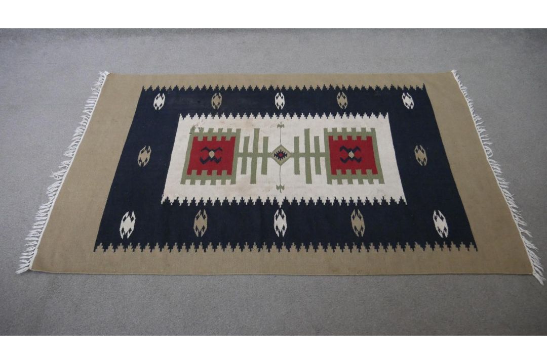 A hand woven Turkish Kelim with geometric serrated pendants on a biscuit ground. L.184 W.117cm - Image 1 of 6