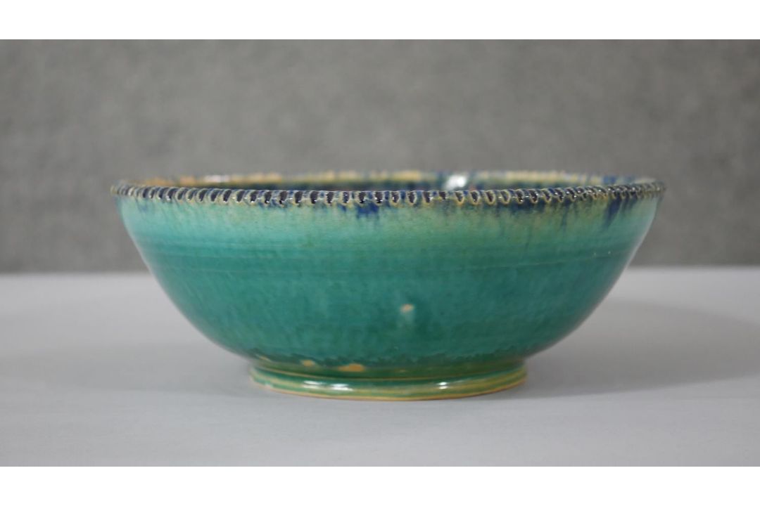 A Persian glazed ceramic bowl, the interior decorated with floral motifs, marked and dated to - Image 7 of 7