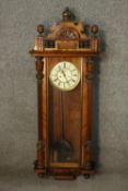 A 19th century walnut cased Vienna Regulator, Gustav Becker with enamel dial. H.124 W.44cm.