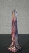 A 19th century purple and opaque white Slag glass obelisk. H.28 W.7 D.7cm