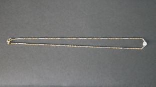 An 18 carat white and yellow gold bar and trace chain link necklace, set with a round brilliant
