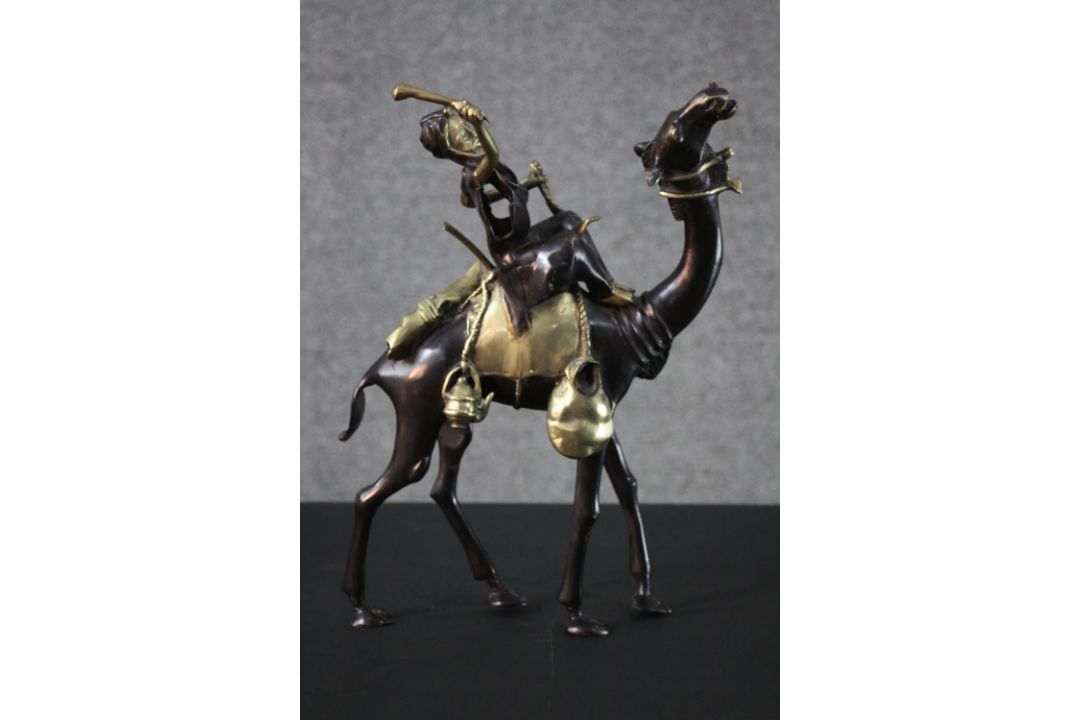 A West African hand made bronze sculpture from Burkina Faso of a camel and rider. Blackened to - Image 1 of 6
