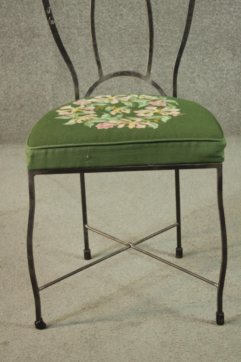 A set of six wrought iron dining chairs with green embroidered seats centred by a floral design. - Image 7 of 12