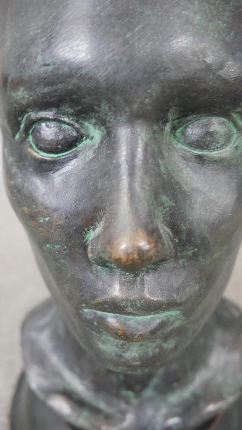 An early 20th century bronze head mounted on a turned ebonised base. H.38 W.20cm - Image 3 of 4