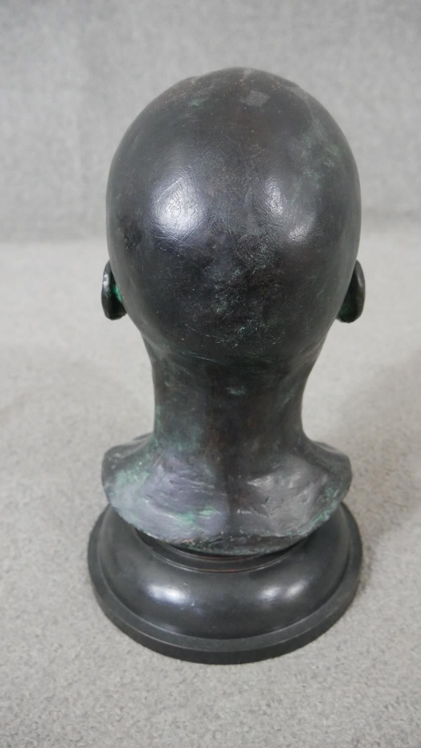 An early 20th century bronze head mounted on a turned ebonised base. H.38 W.20cm - Image 4 of 4