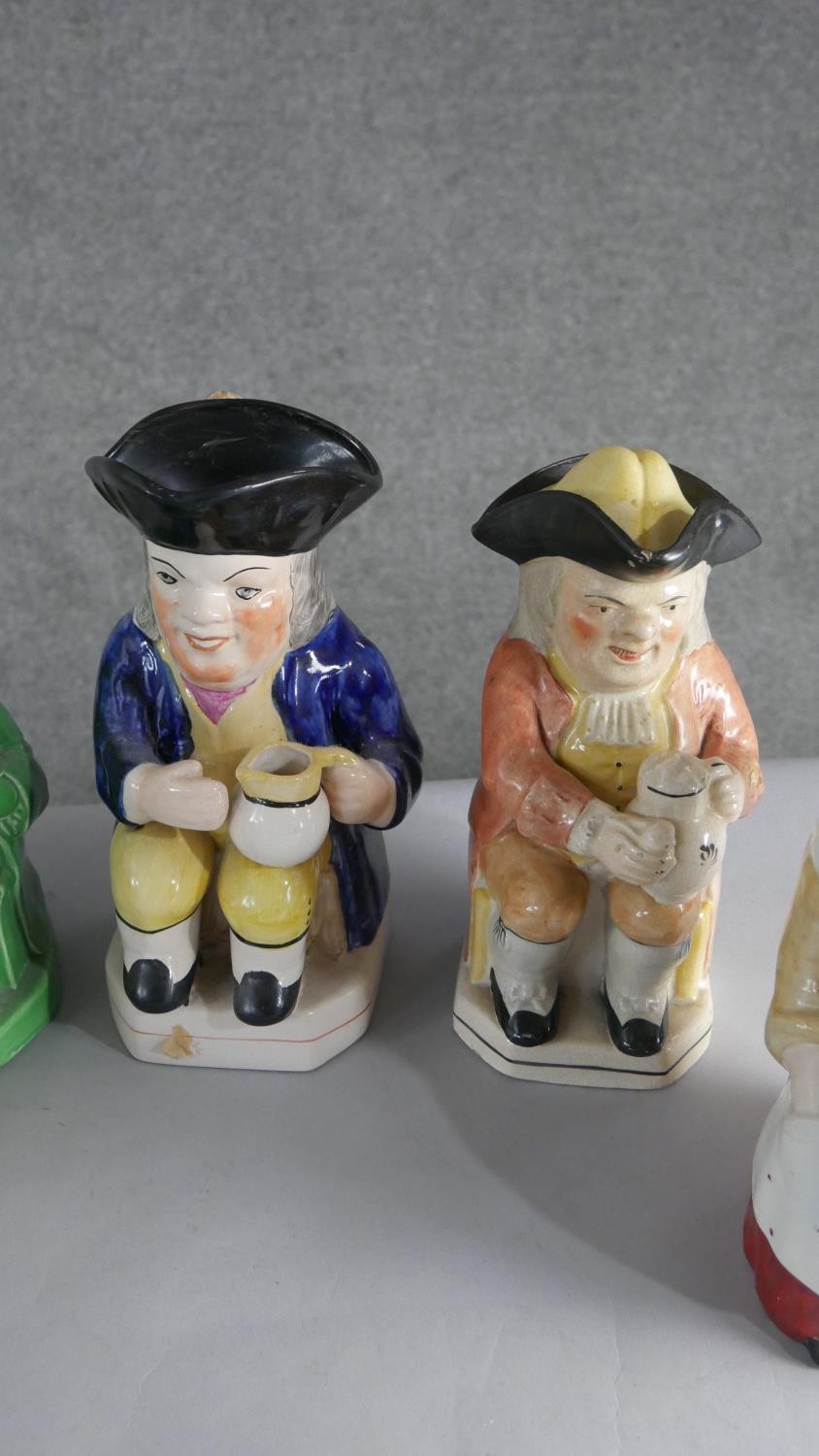 A collection of seven hand painted early 20th century ceramic Toby jugs of various designs. H.28 W. - Image 3 of 4