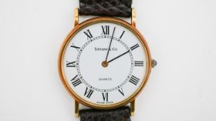 A boxed Men's vintage Tiffany & Co 14 Karat yellow gold and sapphire quartz watch with lizard