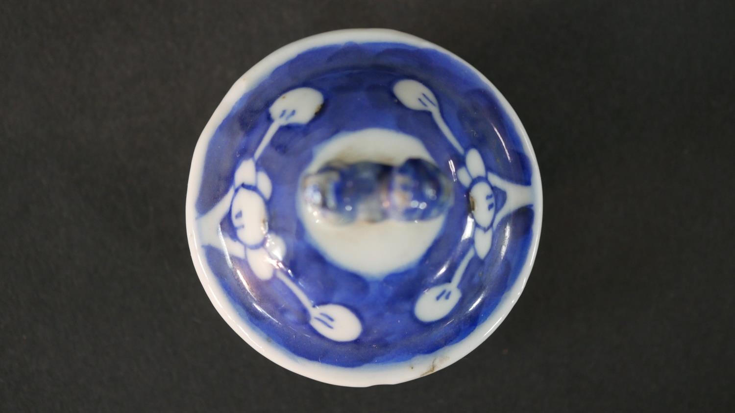 An Chinese blue and white hand painted prunus blossom design ceramic lidded vase. H.13.5 Diam.6cm - Image 7 of 9
