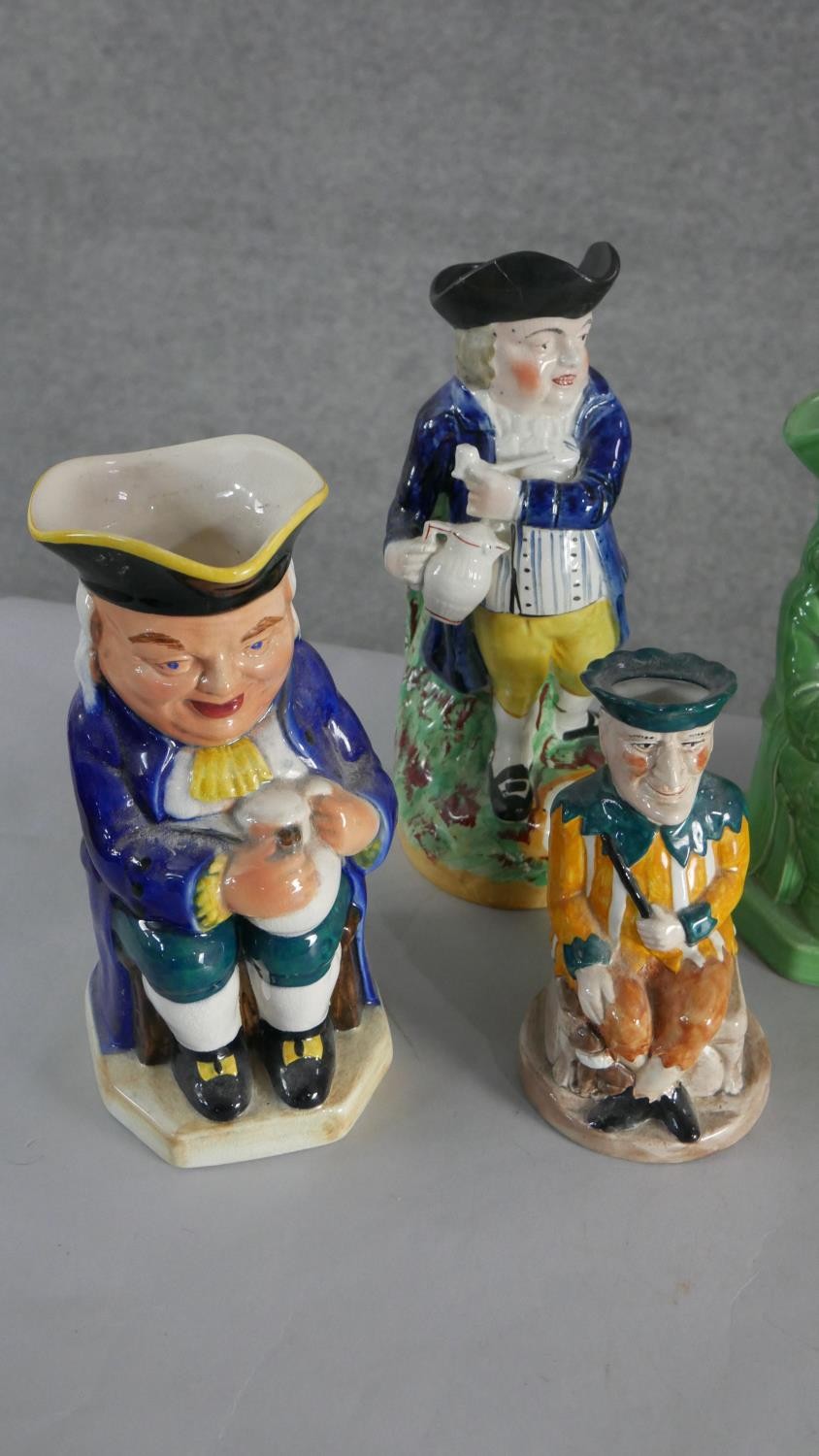 A collection of seven hand painted early 20th century ceramic Toby jugs of various designs. H.28 W. - Image 2 of 4