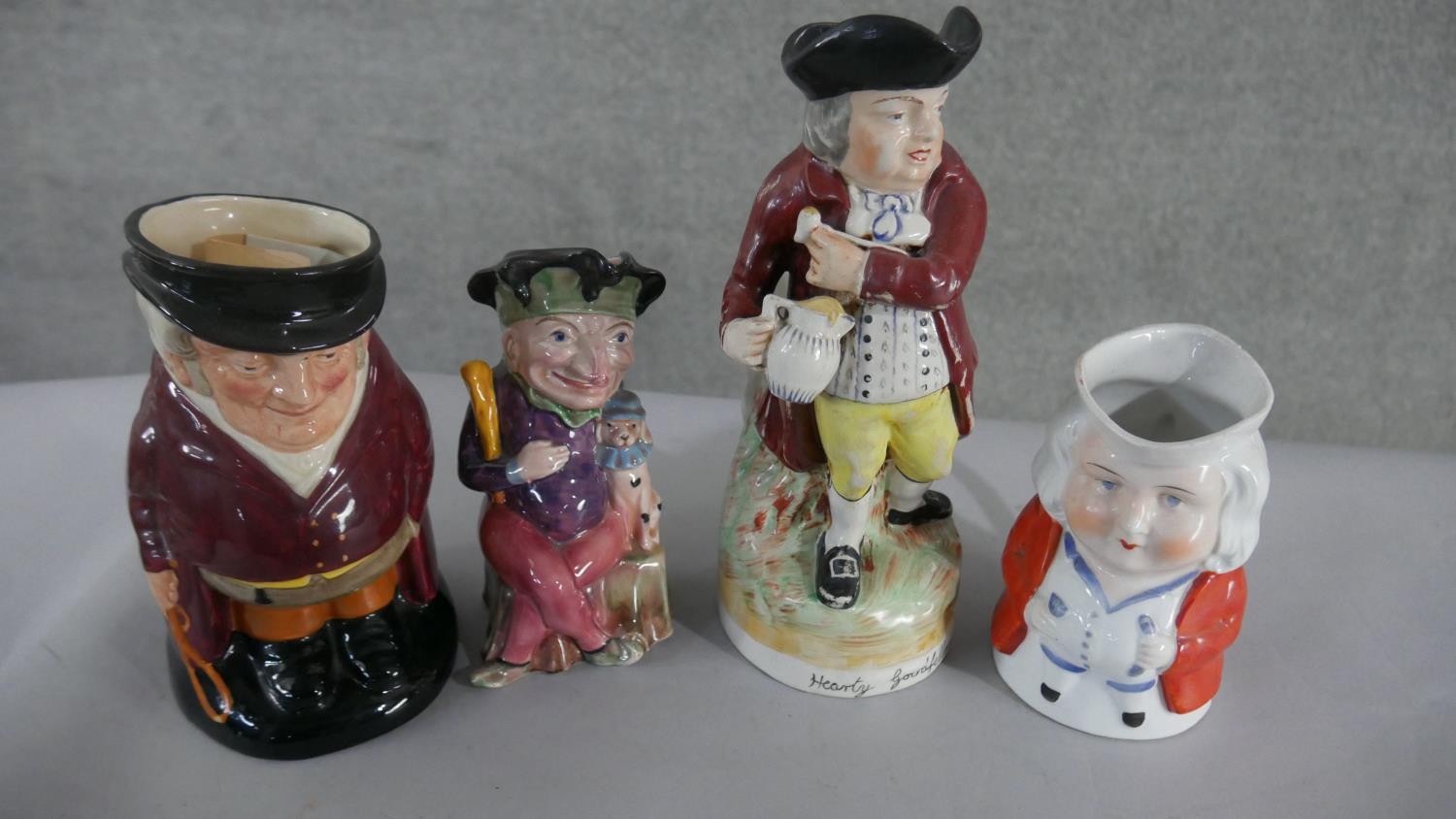 Eight early 20th century hand painted ceramic Toby jugs, various characters and makers. H.28 W. - Image 2 of 3
