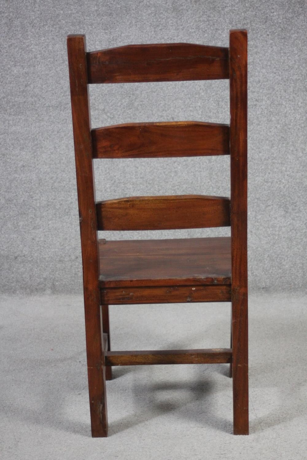 A set of eight mango wood ladder back dining chairs, the legs joined by H stretchers. - Image 8 of 11