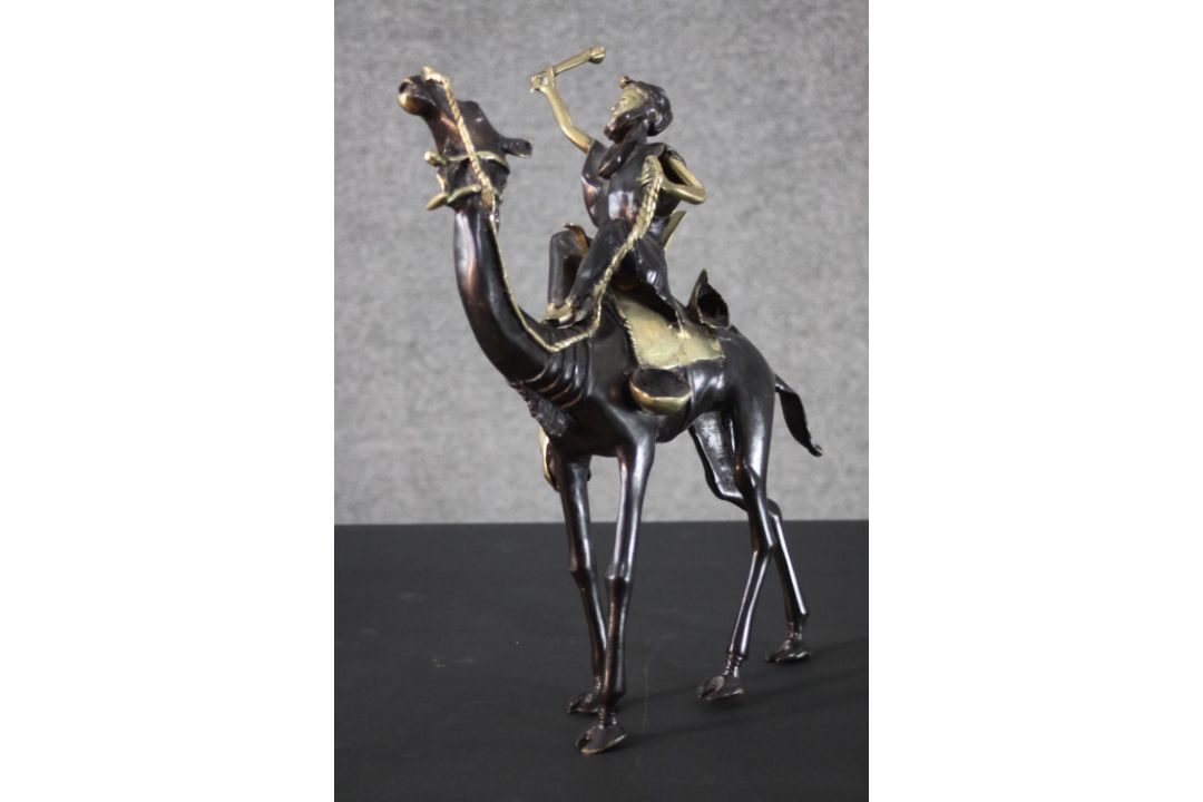 A West African hand made bronze sculpture from Burkina Faso of a camel and rider. Blackened to - Image 3 of 6