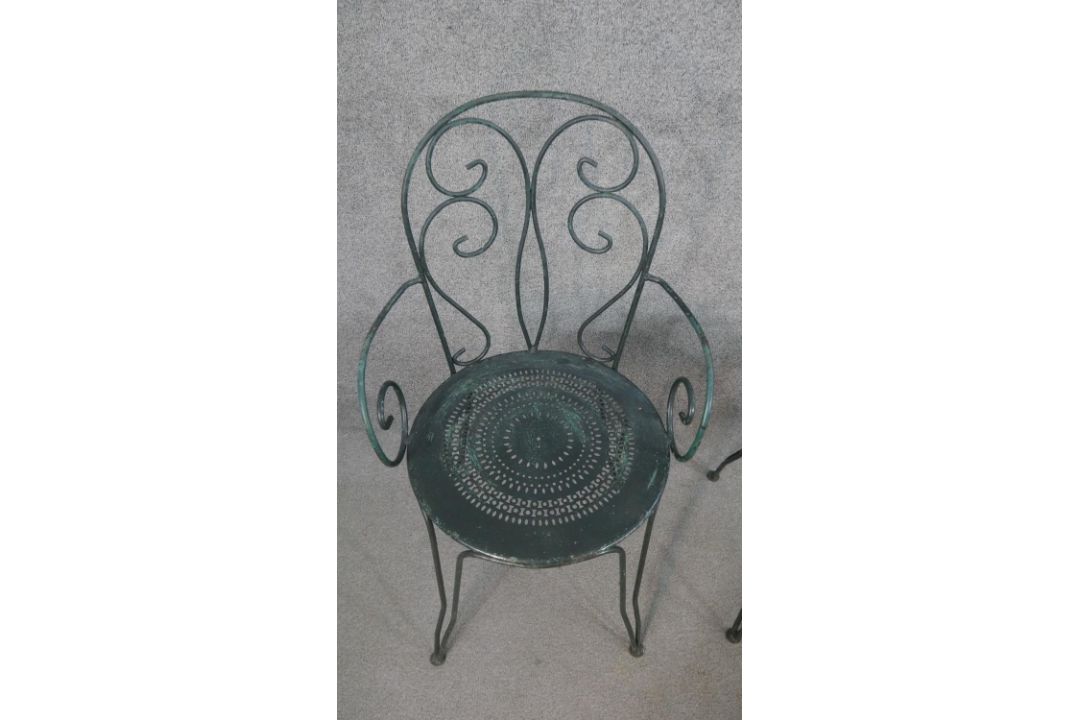 A set of three wrought iron garden chairs, with scrollwork to the back and arms, on a circular - Image 4 of 5