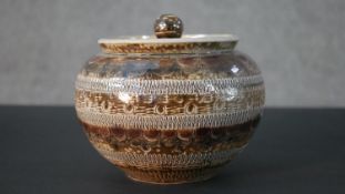 A mid-century studio pottery lidded Jar by Wim Mühlendyck (Bauhaus student), sgrafitto design.