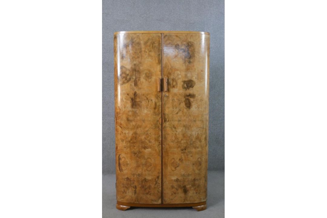 An Art Deco figured walnut compactum wardrobe, with two quarter veneered doors, the fitted - Image 1 of 13