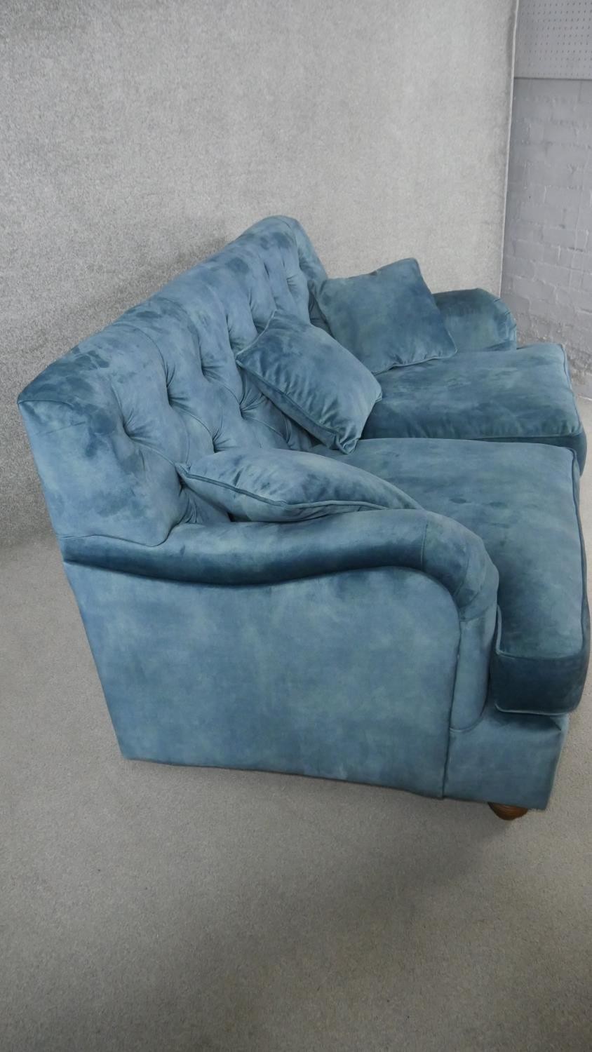 A contemporary Victorian style sofa, upholstered in blue velour, with a buttoned back, on turned bun - Image 2 of 3