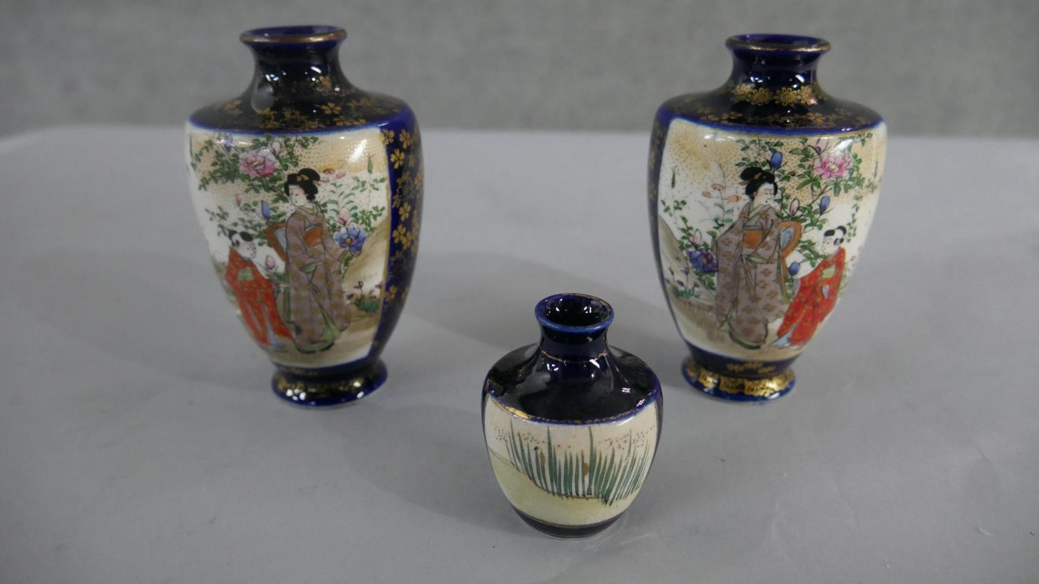 Three Japanese hand painted Satsuma ware vases with geisha girl design, character marks to base. H. - Image 3 of 3