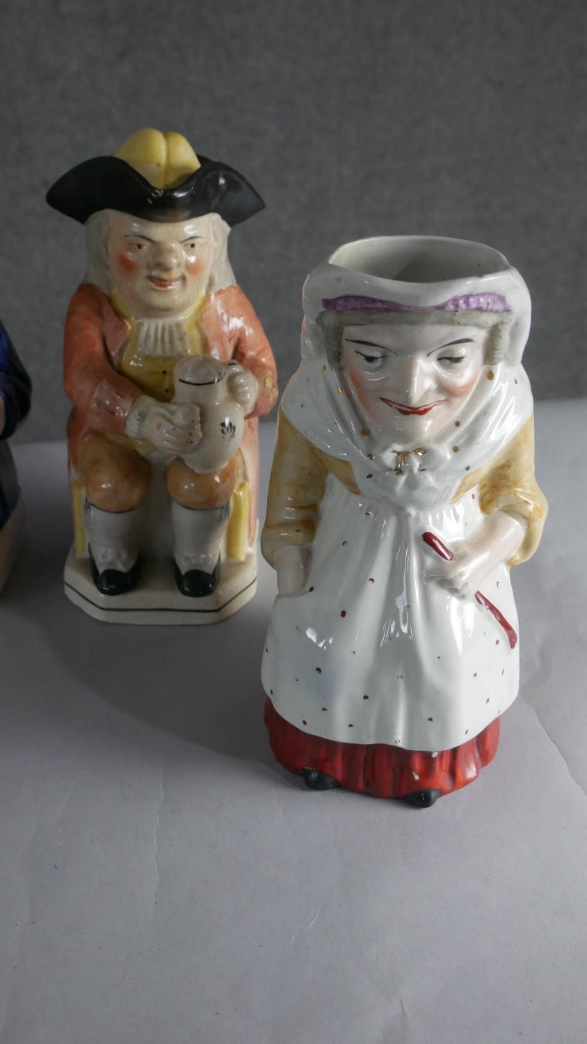 A collection of seven hand painted early 20th century ceramic Toby jugs of various designs. H.28 W. - Image 4 of 4