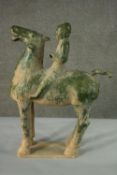 A Chinese Tang style green glaze clay horse and rider on rectangular base. H.69 W.53cm.