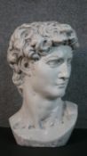 A 20th century painted plaster bust of Michael Angelo's David. H.41 W.25 D.25cm
