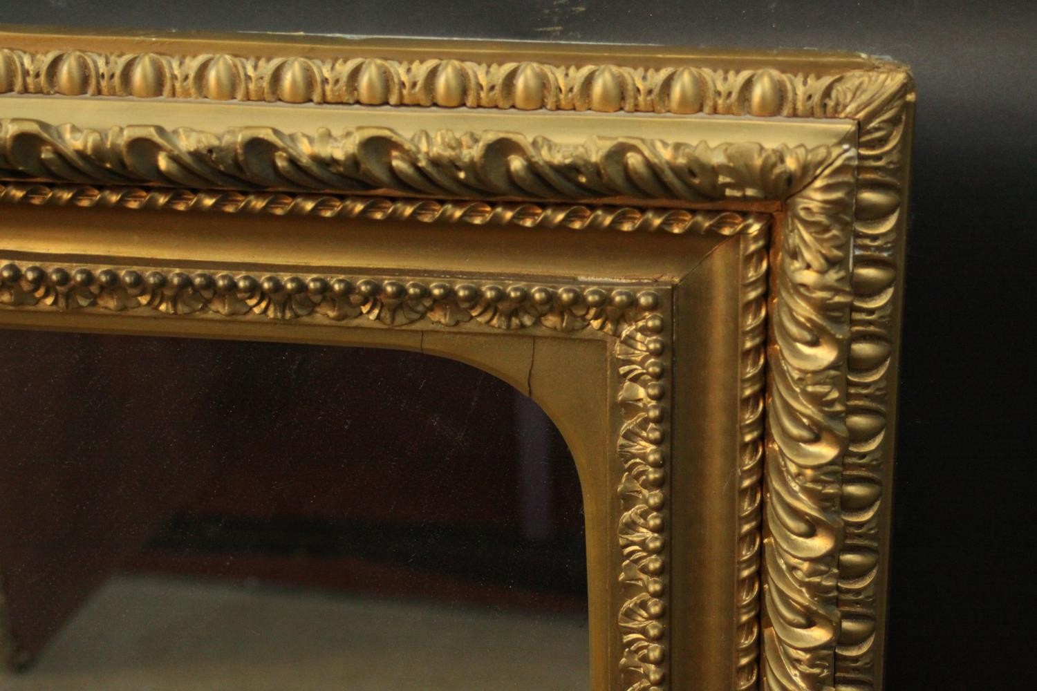 An early 20th century carved giltwood and gesso framed wall mirror. The frame decorated with - Image 2 of 4