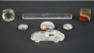 A collection of paperweights. Including a Victorian glass page magnifier and reader, a Waterford