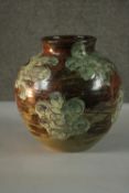 An art pottery glazed vase with floral design, signed Bernard to base and with potters label. H.23
